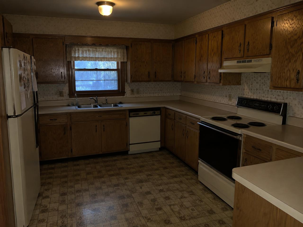 Before: Dated oak kitchen to open-concept island kitchen